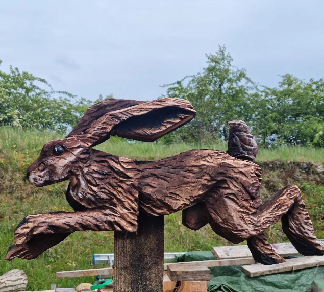 The Mad Hare carved in wood by Richie Clarke wood sculptor